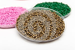 The plastic granules. Dye for polypropylene, polystyrene granules into a measuring container