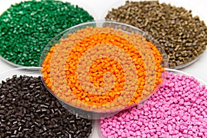 The plastic granules. Dye for polypropylene, polystyrene granules into a measuring container.