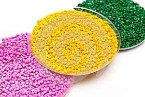 The plastic granules. Dye for polypropylene, polystyrene granules into a measuring container.