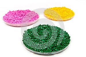 The plastic granules. Dye for polypropylene, polystyrene granules into a measuring container