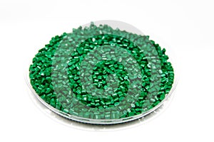 The plastic granules. Dye for polypropylene, polystyrene granules into a measuring container.