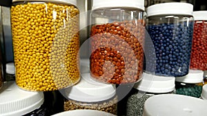Plastic granules and pellets, Raw different colors recycled polymer materials for plastic products. The plastic factory