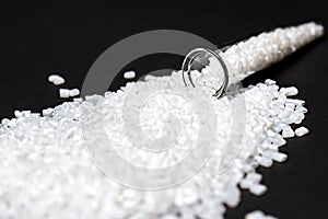 Plastic in granules. Polymer. on a black background.