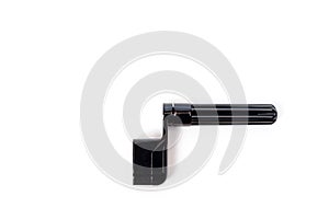 Plastic guitar string winders in black, shot on a white background