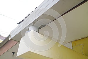 Plastic gutter above the house