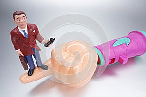 Plastic Hand with Businessman Figurine