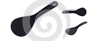 Plastic, heat-resistant spoon stirrer for multicooker. Black spoon isolated on white background