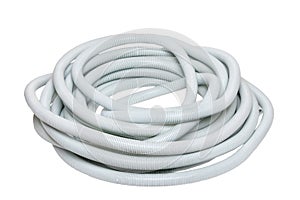 Plastic hose isolated. Close-up of a roll of light gray industrial flexible plastic corrugated pipe for electrical cable
