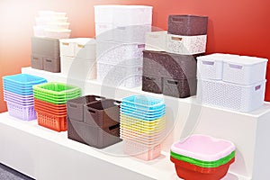 Plastic household containers in store