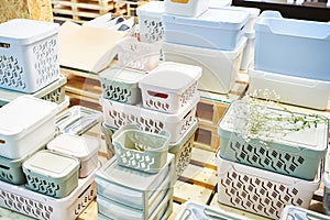 Plastic household containers in store