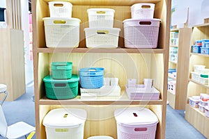 Plastic household containers in store