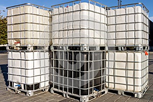 Plastic IBC tank, container with metal pallet for storing and transporting liquid