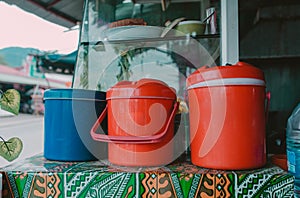 Plastic Ice Coolers with cold water and ice in Asian street restaurant