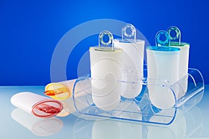 Plastic ice cream lolly form molds stand on plexiglas stand