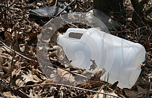 A plastic jug outside on the grounds