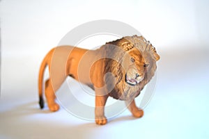 A kids toy lion on a white background.