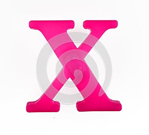 Plastic letter X of the English alphabet against white background