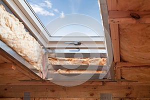 Plastic mansard or skylight window on attic with environmental