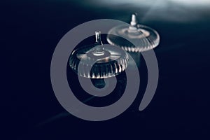 Plastic mouse scroller wheels on dark background