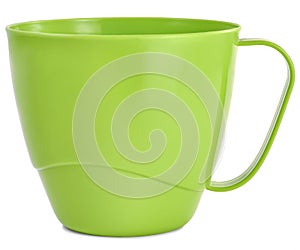 Plastic mug green on the table