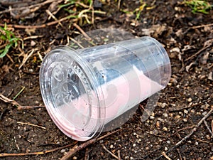 Plastic mug in nature Environmental destruction