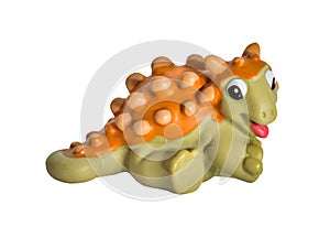 Plastic orange dinosaur toy, Ankylosaurus.