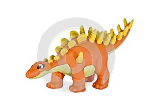 Plastic orange dinosaur toy, Kentosaurus.