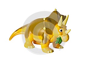 Plastic orange dinosaur toy, Triceratops