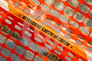 Plastic orange safety net to delimit the area of a construction photo