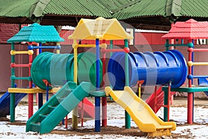 Plastic outdoor kids playground in winter