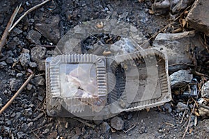 Plastic packaging lies on the ground, garbage on the street, environmental disaster