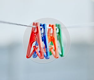 Plastic pegs, collection and outdoor for after washing to balance, holding and dry laundry. Domestic, chores and clothes