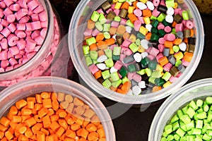 Plastic pellets. Dyes for plastic, polypropylene, polyethylene. Plastic granules in a measuring container and test tubes in the