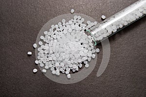 Plastic pellets . Plastic raw materials in granules for industry. Transparent polyethylene pellets.