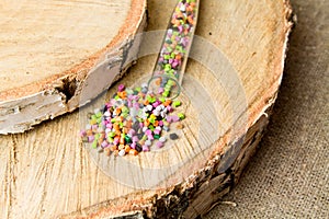 Plastic pellets .Polymeric dye in test tubes on gray background. Plastic granules after processing of waste polyethylene and