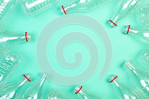 Plastic PET bottles on a mint green background. Waste sorting, environmental care.