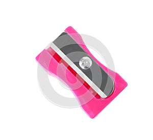 Plastic pink pencil sharpener isolated on white, top view