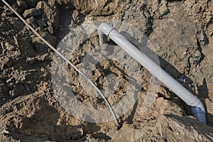 Plastic pipes in the ground during the construction of a building, bunner