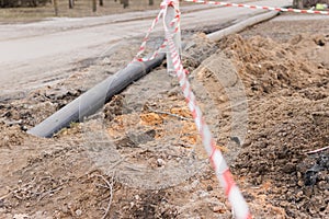 Plastic pipes in the ground during construction on the street