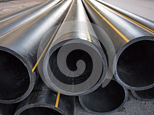 Plastic pipes of large diameter black closeup