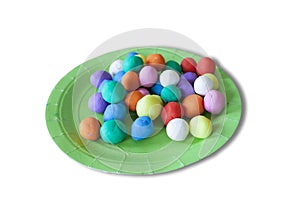 Plastic plate full of colorful playdough balls