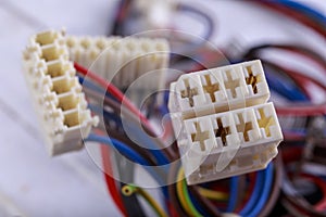 Plastic plugs mounted on electric cables. Electrical connectors for connecting devices and components.