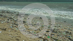 Plastic pollution beach. Heavy pile of garbage in asian countries. Ecology catastrophe. World disaster.