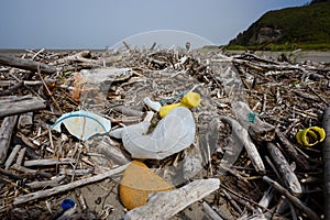 Plastic pollution nets bottles foam on ocean beach