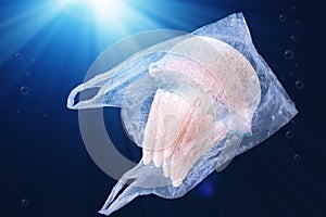 Plastic pollution in ocean environmental problem concept.  jellyfish swim inside plastic bag floating in the ocean.