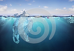 Plastic Pollution In Ocean- Plastic Bag Floating On Sea