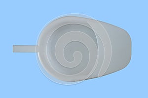 Plastic portable bedside hospital urinal toilet. View from above