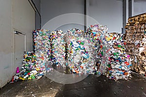 Plastic pressed bales at the modern waste hazardous processing plant. Separate garbage collection. Recycling and storage of waste