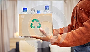 Plastic, recycle and hands with bottle in box in living room for eco friendly, reuse and renewable litter