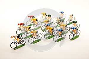 Plastic road cyclists. Competition. Peloton.